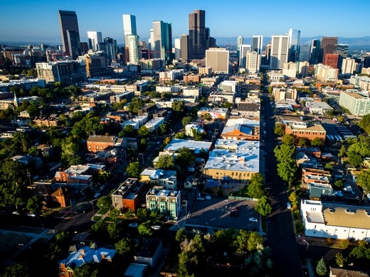 High-altitude aerial drone perspective of the Denver central business district.