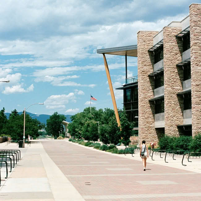 Students walking through the Colorado State University (CSU) campus green