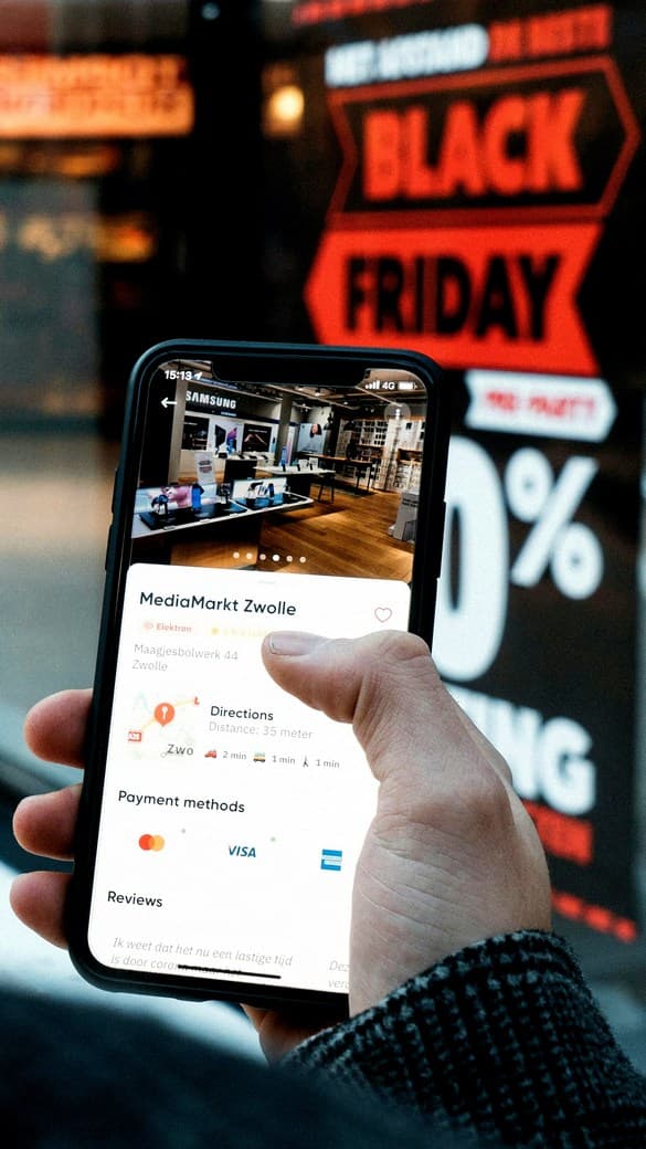 Man holding a smartphone with an online store app — Denver eCommerce SEO services