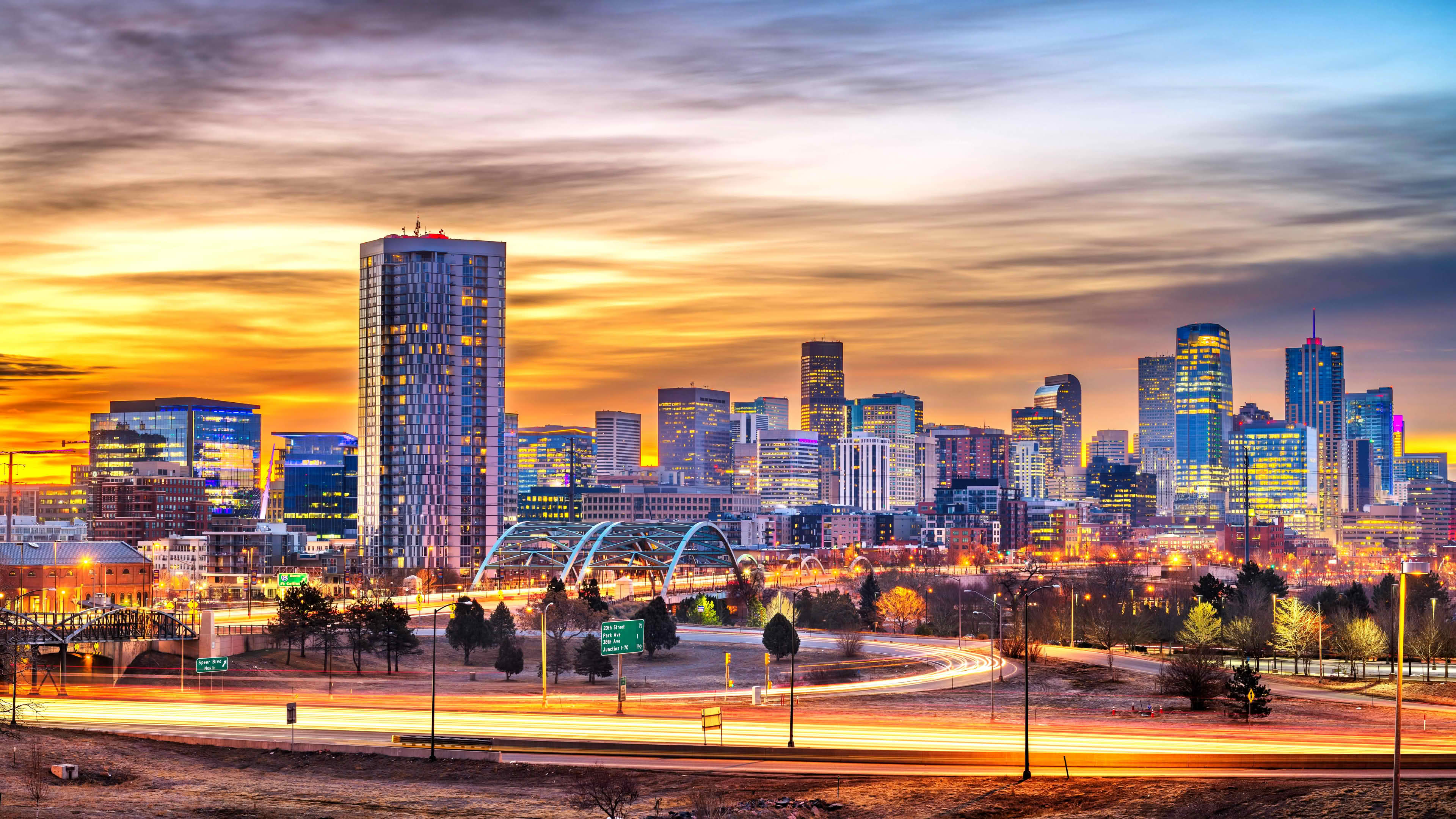 Breathtaking evening skyline of Denver Central Business District with traffic light trails