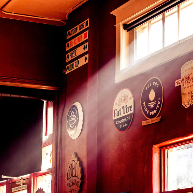 Slyce Pizza Co. storefront showcasing local retail business in Old Town Fort Collins.