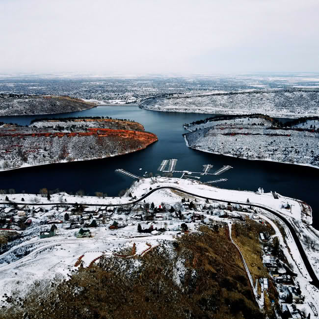 Snow-covered landscape at Horsetooth Reservoir during winter in Northern Colorado